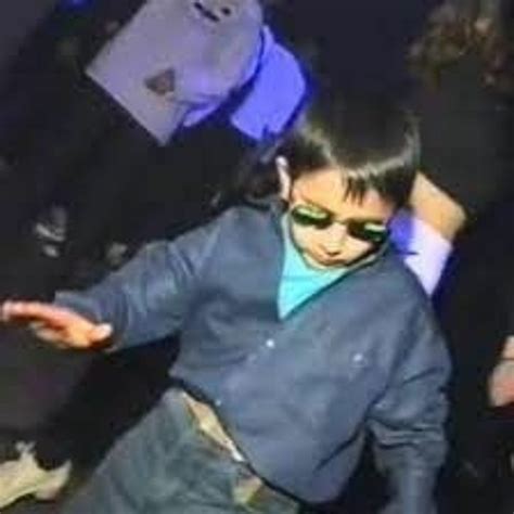 kid with round sunglasses dancing